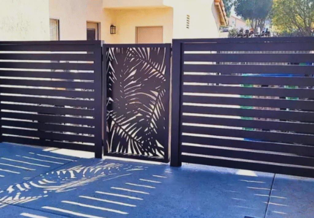 A custom 5-foot horizontal aluminum slat fence and matching decorative backyard access gate installed by a premier Houston privacy wall contractor.