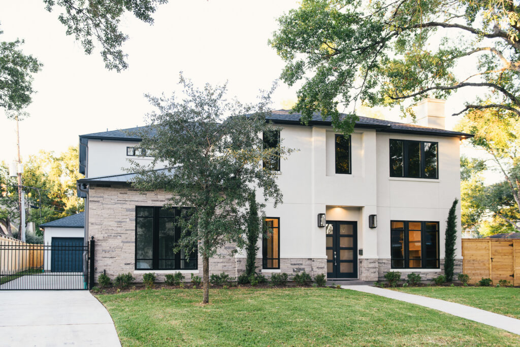 Professional roofing and home remodeling services in Houston by Luxscape, featuring a combination of standing seam metal and composition roofing on a contemporary home in the Briargrove subdivision.