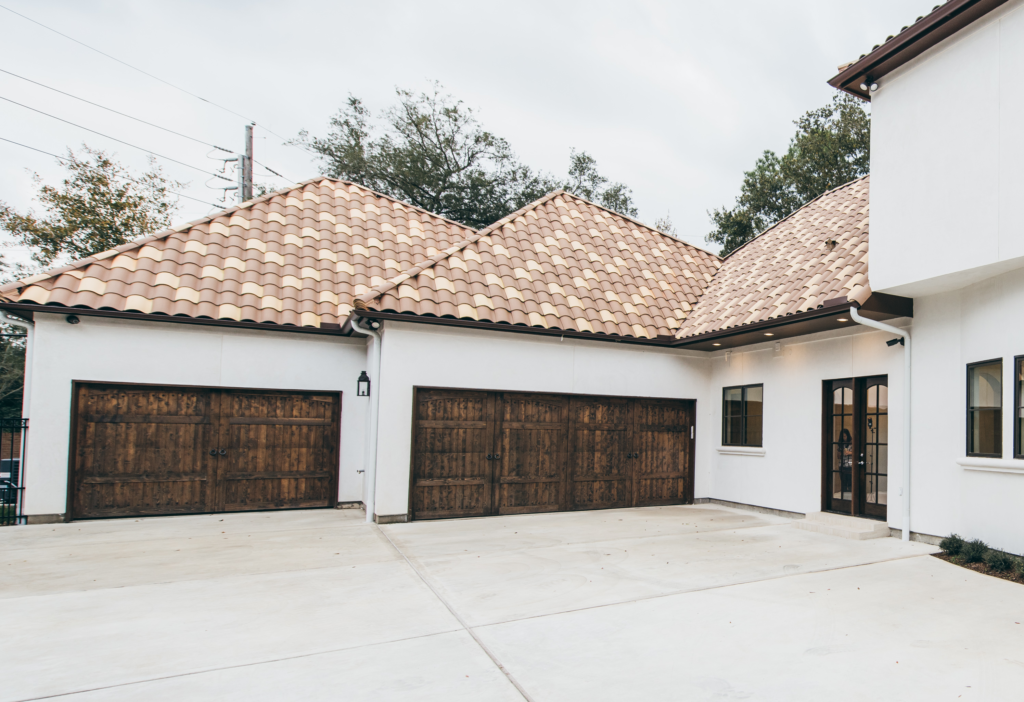 Professional roofing and home remodeling services in Houston by Luxscape, featuring a custom tile roof installation on a residence in the Tanglewood subdivision.