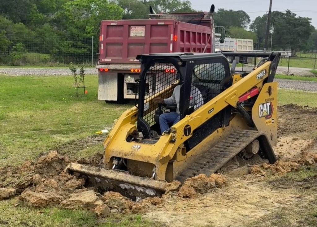 Excavation of a custom inground pool, dug to the approved layout before steel and gunite, designed for Cypress homeowners by Luxscape Outdoor Builders serving Houston, TX.